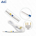 Close-up of the yellow and blue control buttons on the Azatek monopolar electrosurgical handpiece